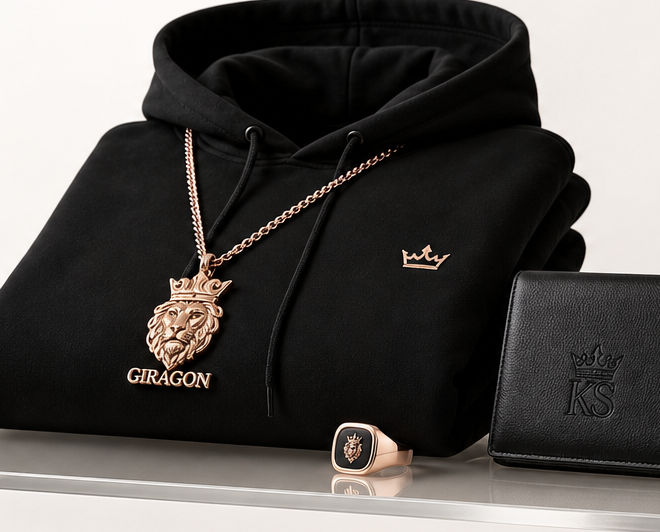 KingShadP black hoodie, rose gold Giragon relic, and leather accessory on a platinum display shelf